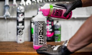 Muc-off cleaner being refilled