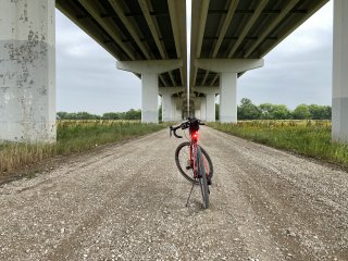 Marin Nicasio parked on a gravel road under a bridge